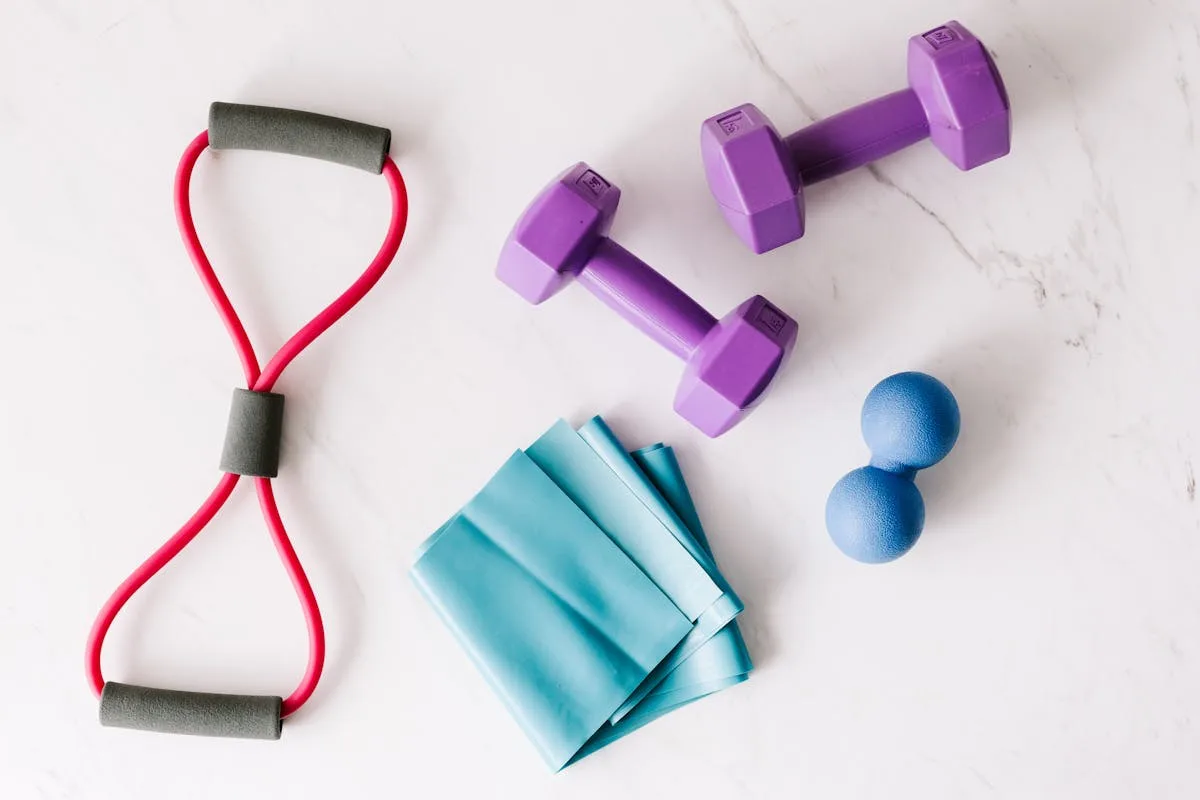 Budget home gym setup with dumbbells, pull-up bar and yoga mat