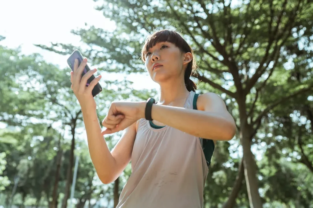 Runner checking fitness watch on a run