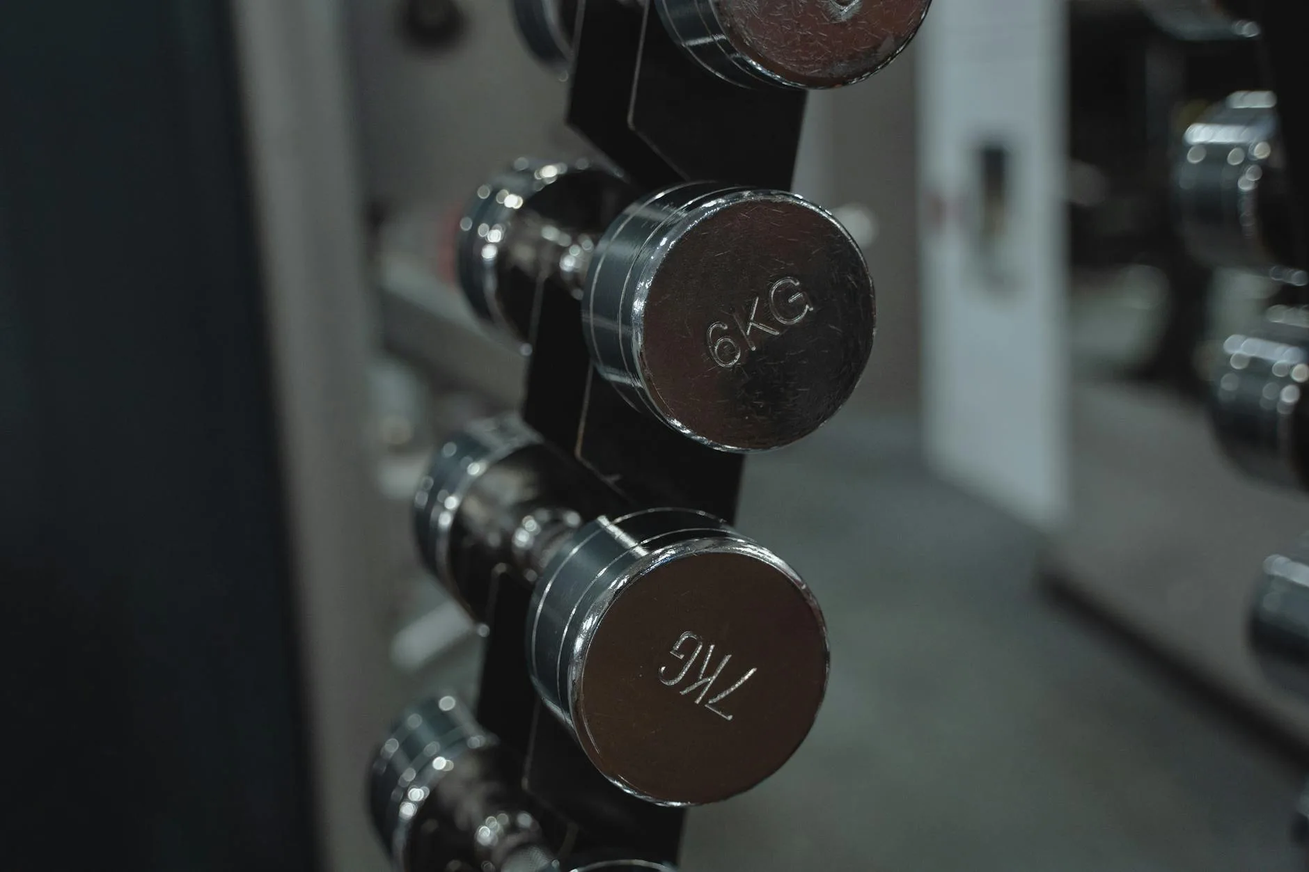 Dumbbells on a rack in a home gym setup