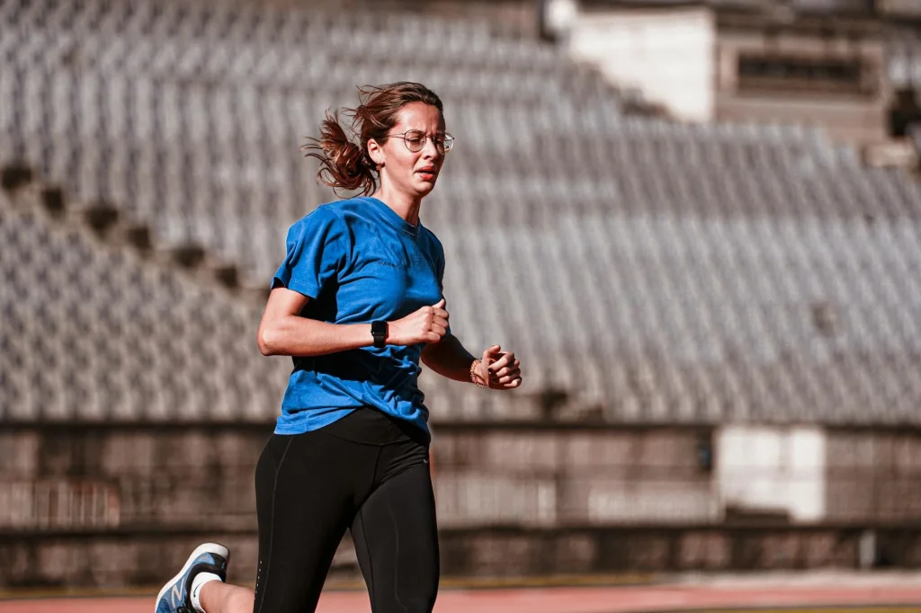 Person wearing a chest strap heart rate monitor during a workout