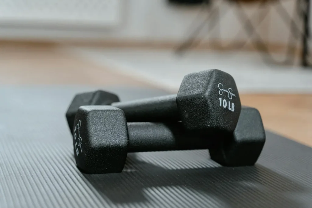 Set of dumbbells on a home gym floor ready for workout