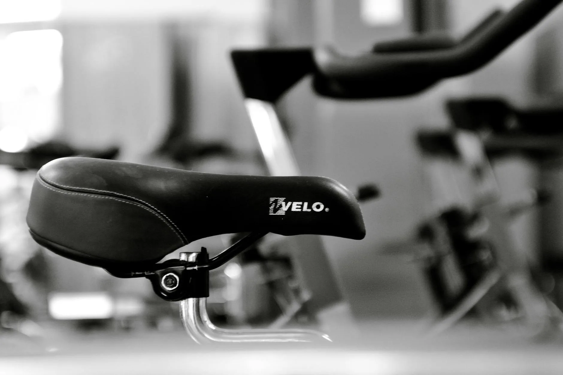 Exercise bike being adjusted for correct riding position at home
