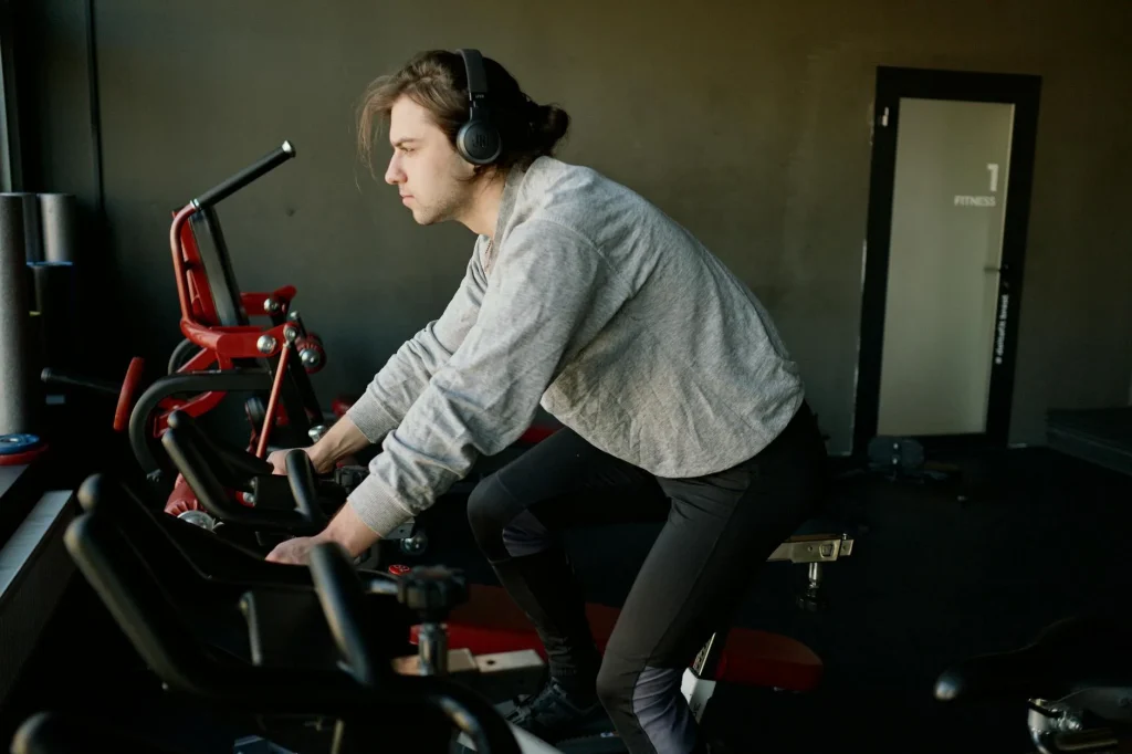 Person riding an exercise bike during a home gym workout