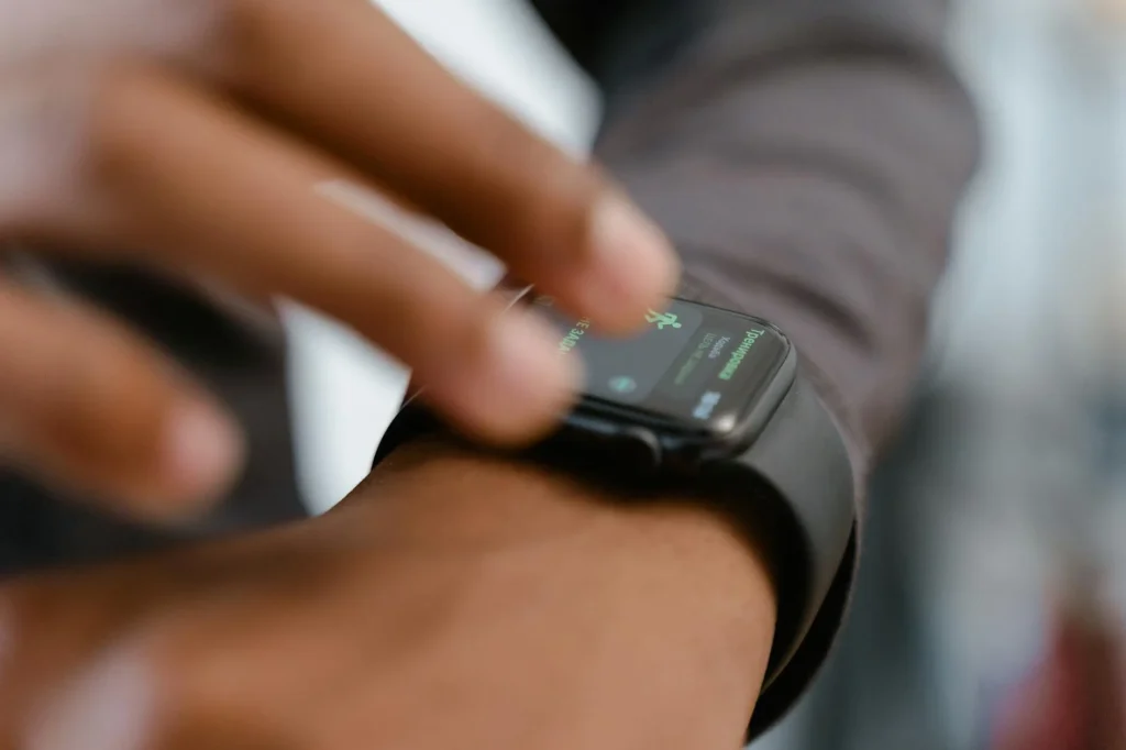 Fitness tracker on a wrist during a gym workout