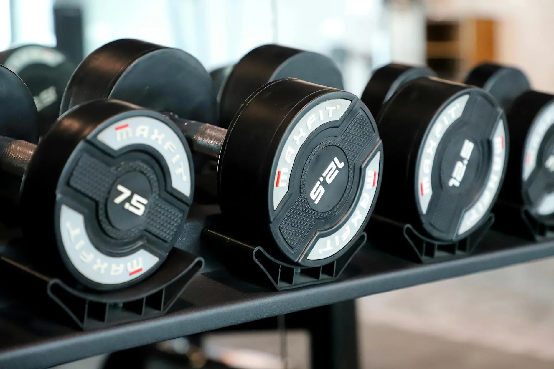 Dumbbells on a rack in a home gym setup