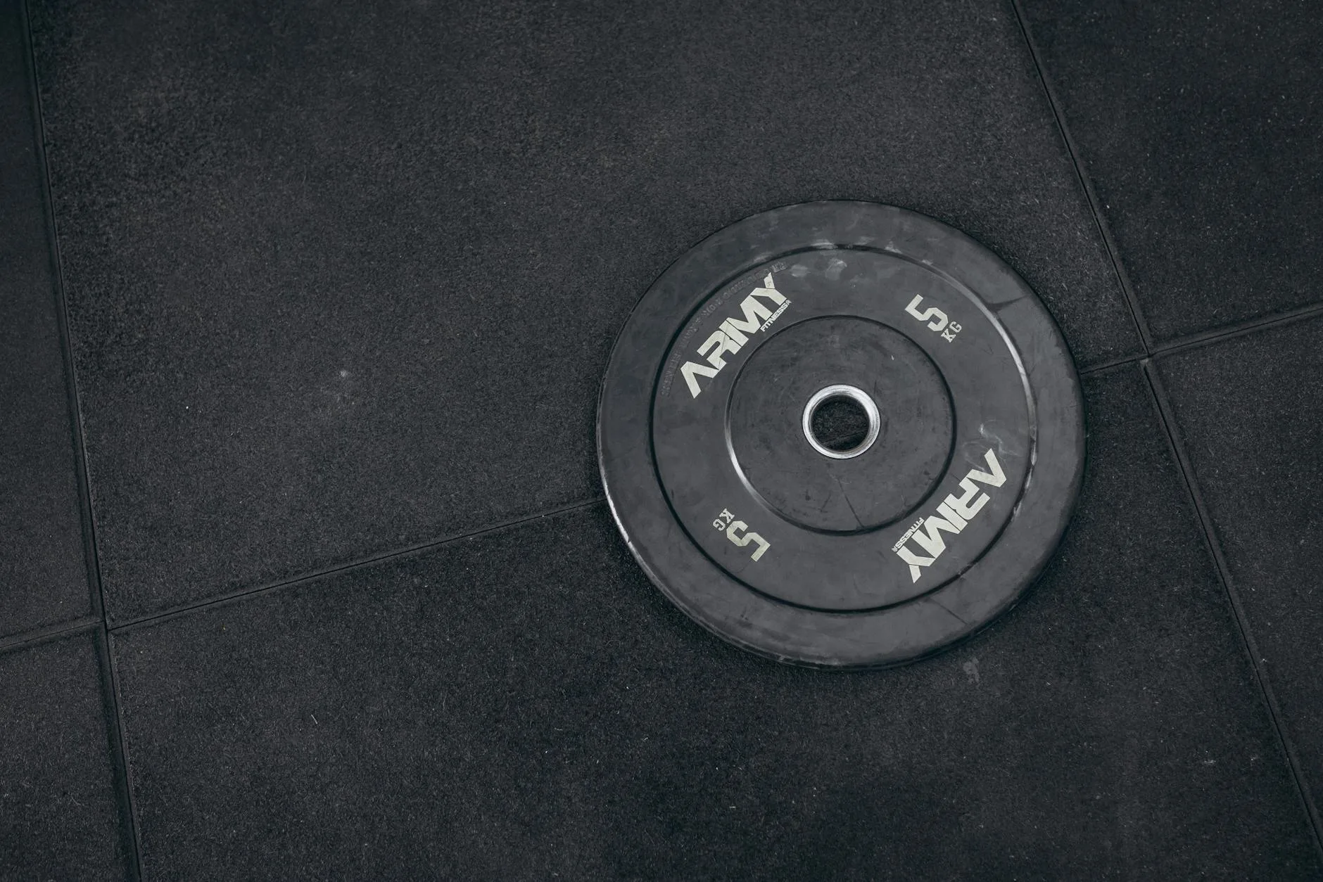Garage home gym with squat rack on rubber flooring