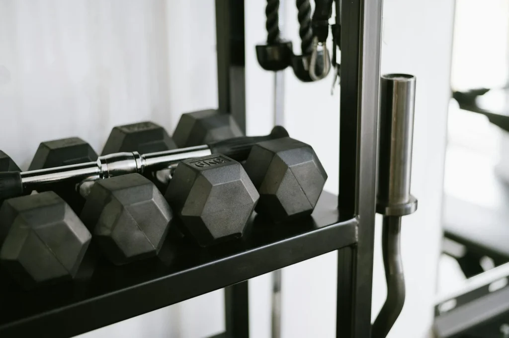 Home gym setup with weights and equipment in a garage