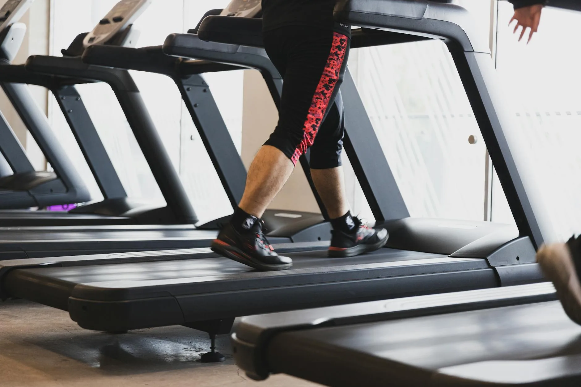 Runner on a treadmill in a gym during a training session