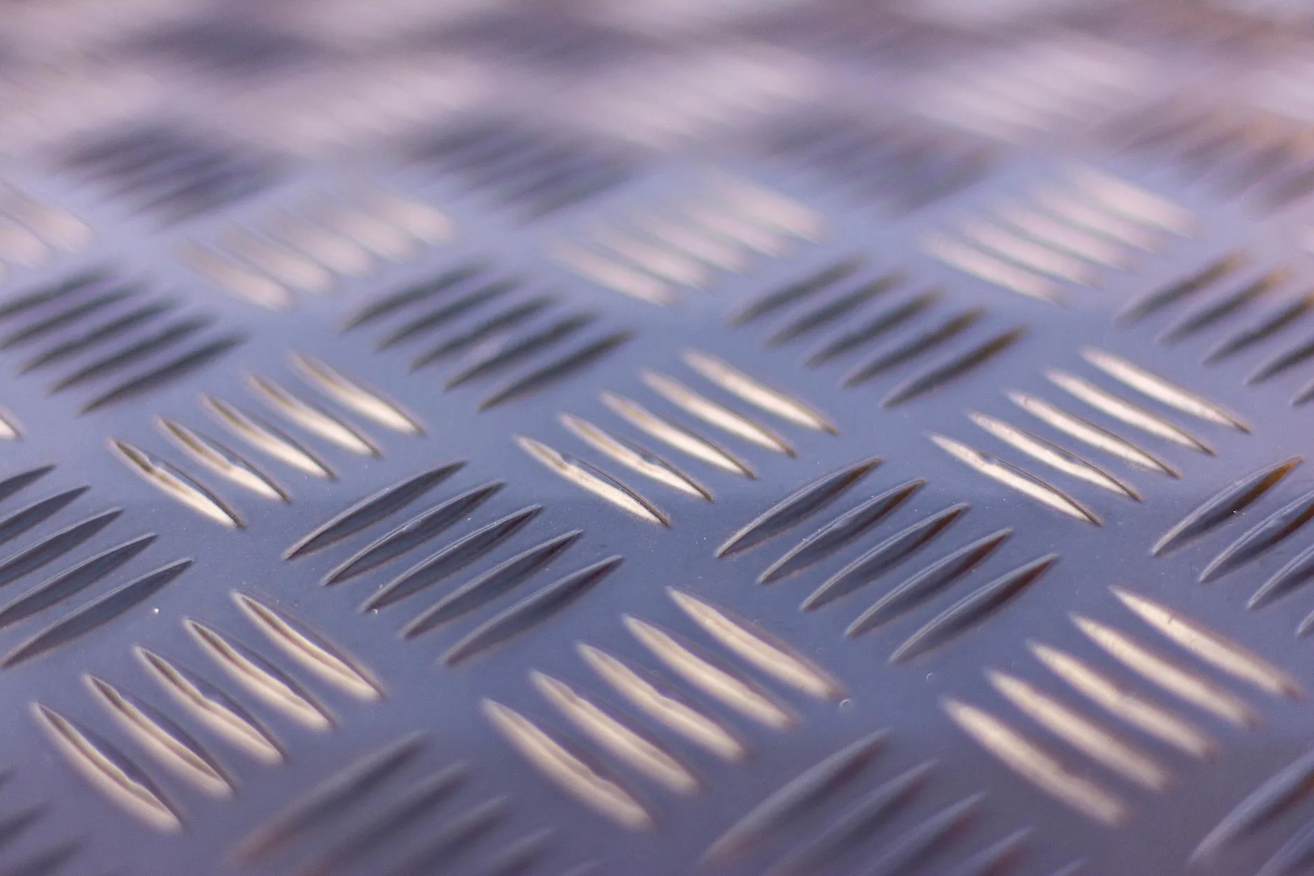 Close-up of barbell knurling showing grip texture