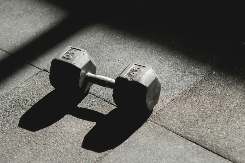 Dumbbell on a home gym floor ready for workout