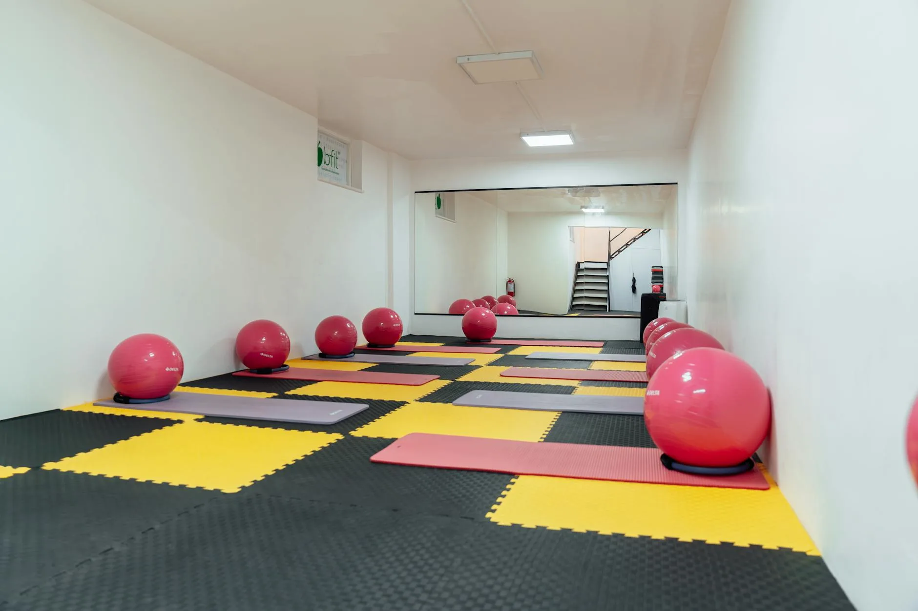Rubber gym flooring tiles installed in a home gym