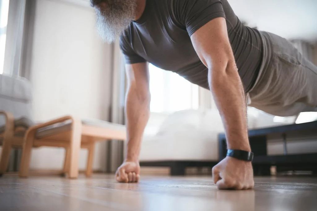 Person doing push ups at home on the floor