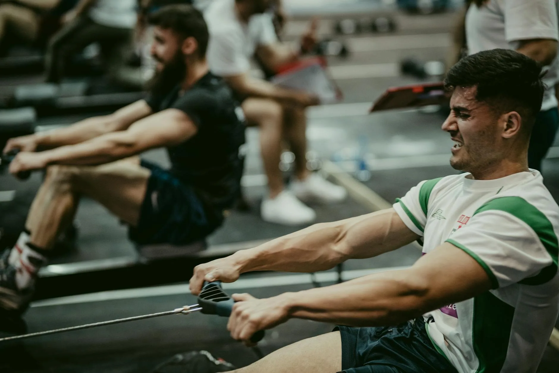 Athlete exercising on a rowing machine during a workout