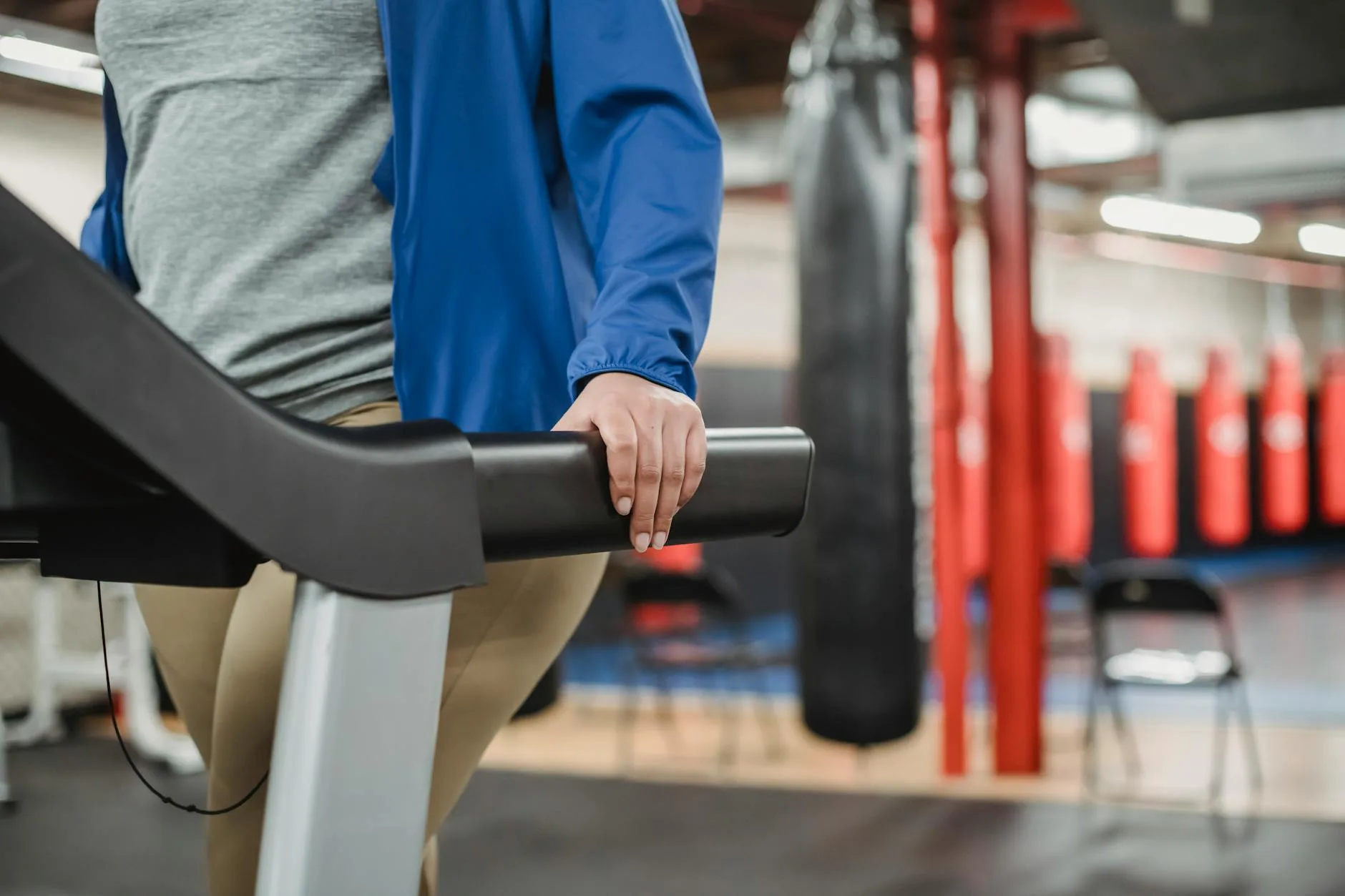 Person running on a treadmill during a cardio workout