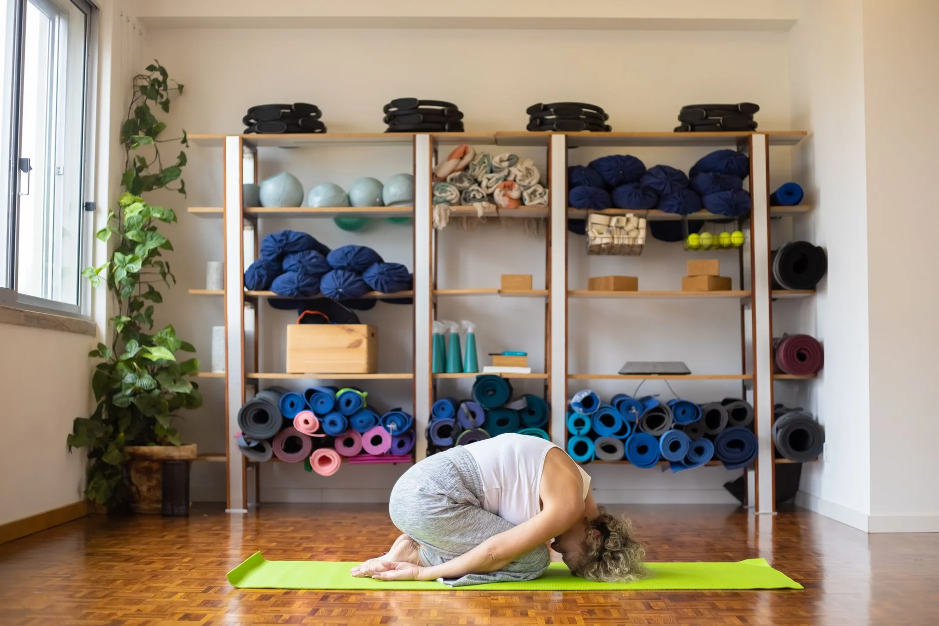 Yoga mats blocks and props stored ready for beginner practice