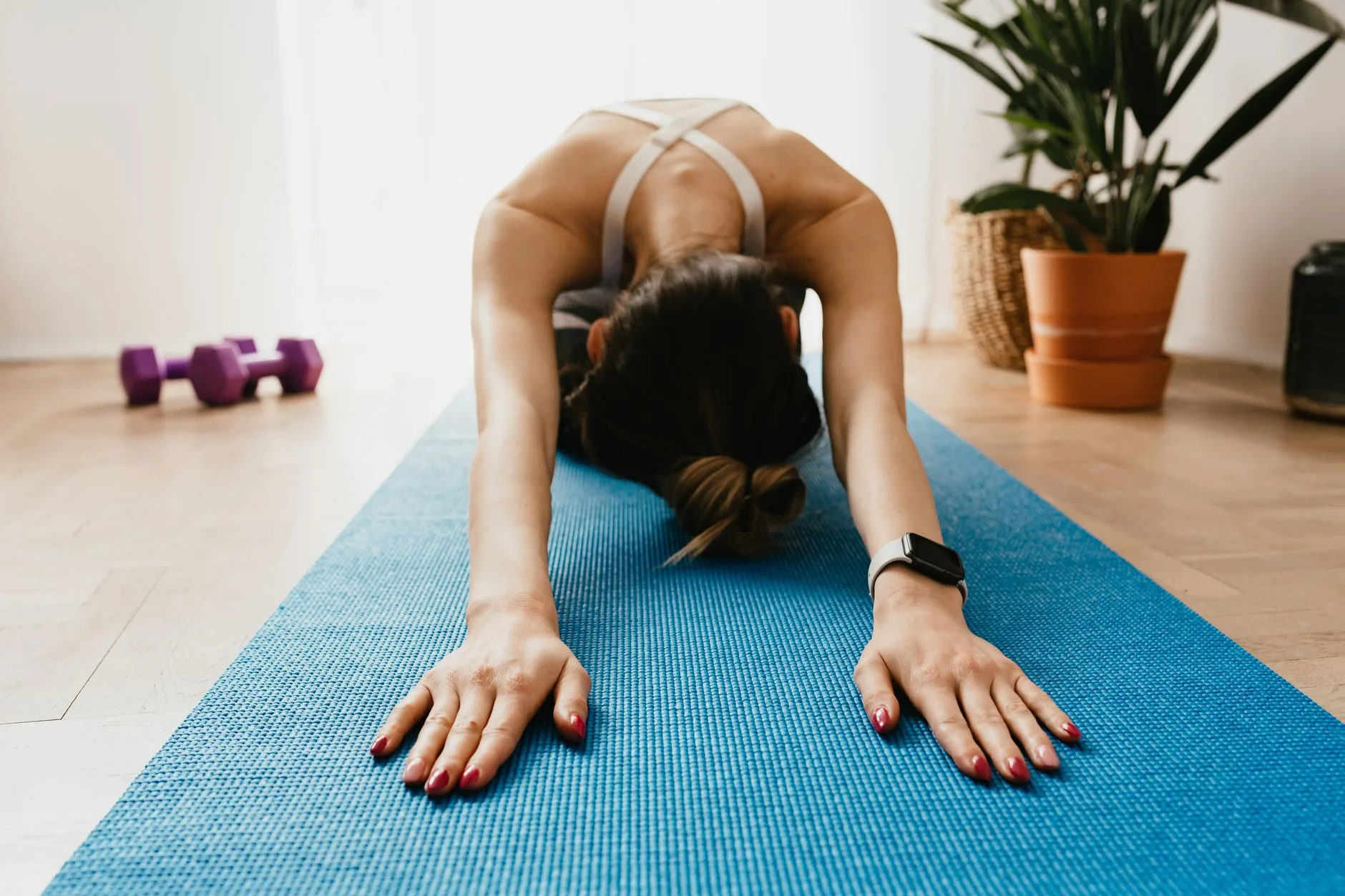 Gentle beginner yoga pose on a mat at home