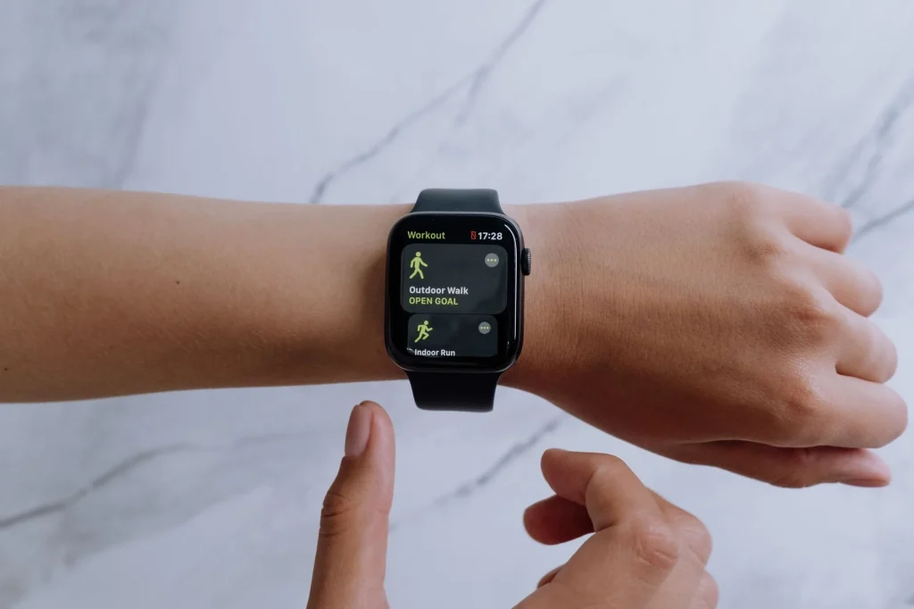GPS running watch on a wrist during an outdoor run