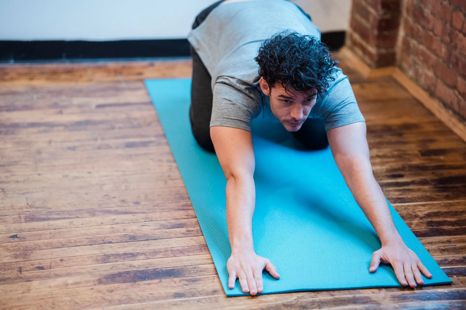 Gentle stretching on a mat as part of a home recovery routine
