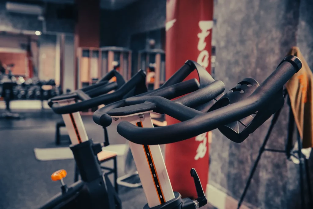 Indoor cycling bikes lined up in a gym